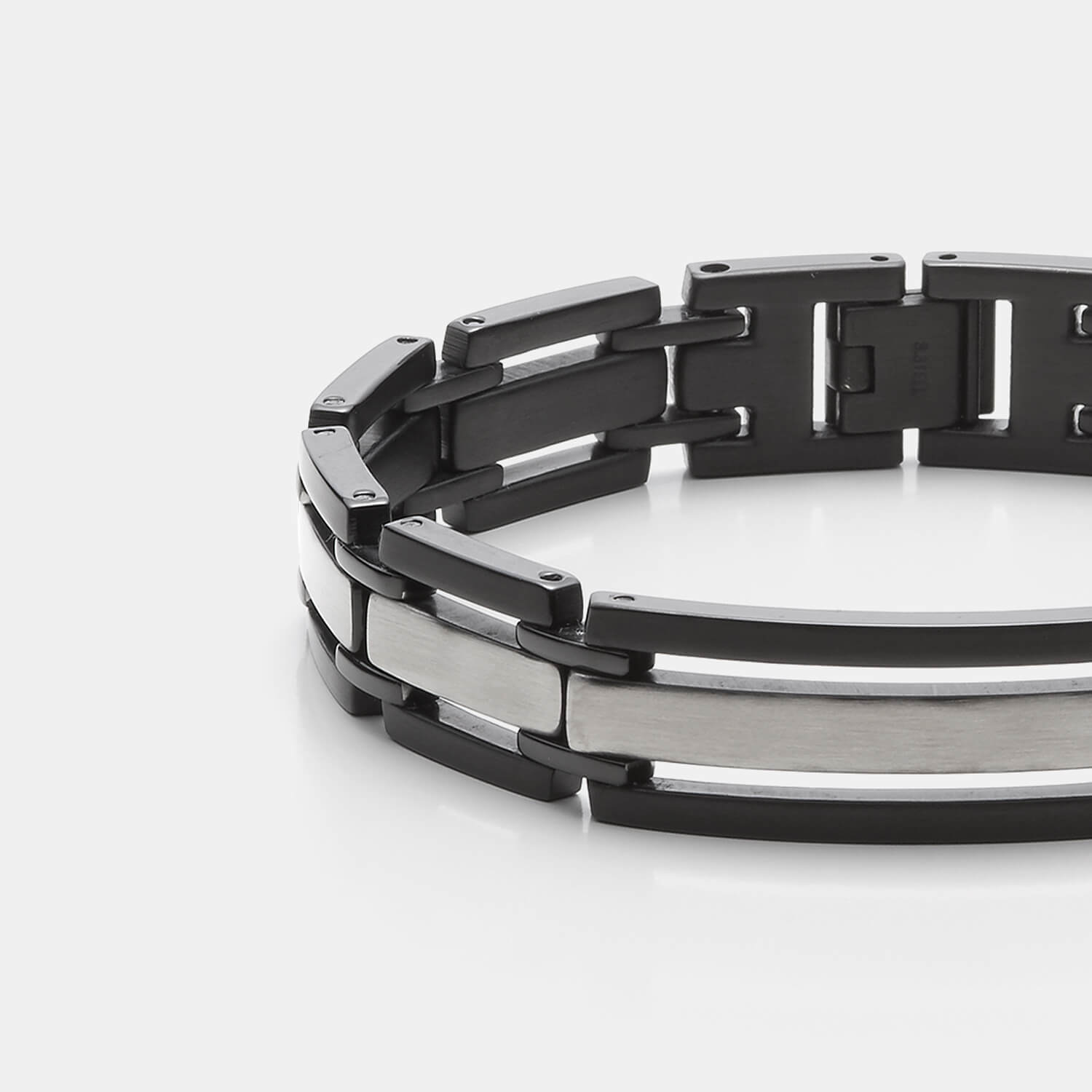 Gesamtansicht eines markanten, schwarz-silbernen Gliederarmbandes aus antiallergenem Edelstahl von MONOMANIA.