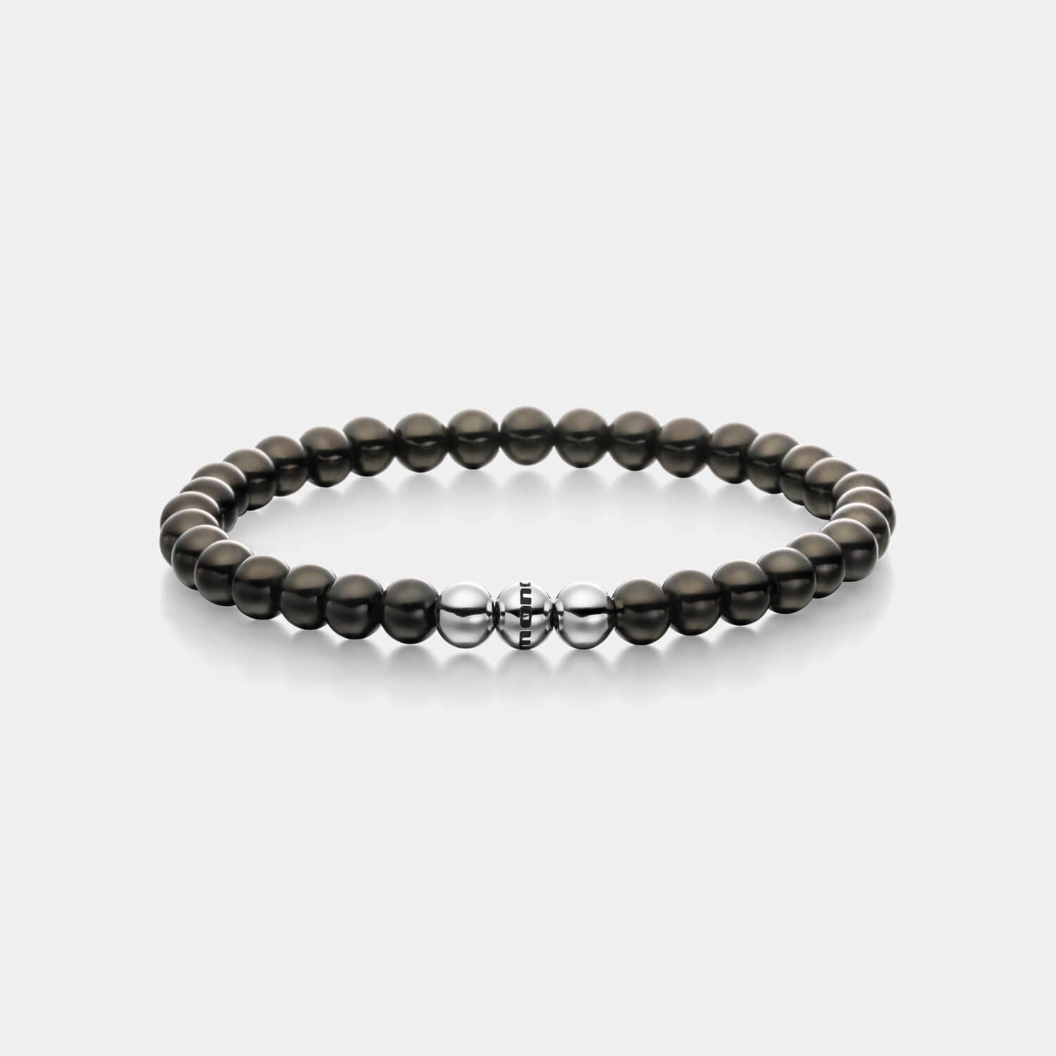 Gesamtansicht eines schwarzen Perlenarmbandes aus schwarz-beschichteten, antiallergenen Edelstahl-Perlen mit drei silberfarbenen Edelstahlperlen.
