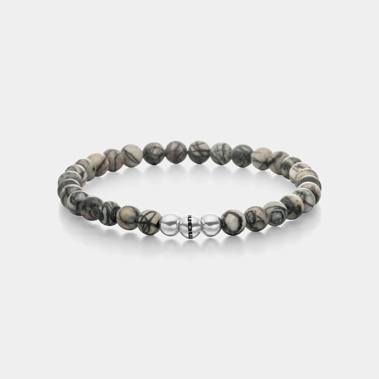 Gesamtansicht eines Perlenarmbandes aus echten grauen Basalt-Perlen mit drei antiallergenen Edelstahlperlen.