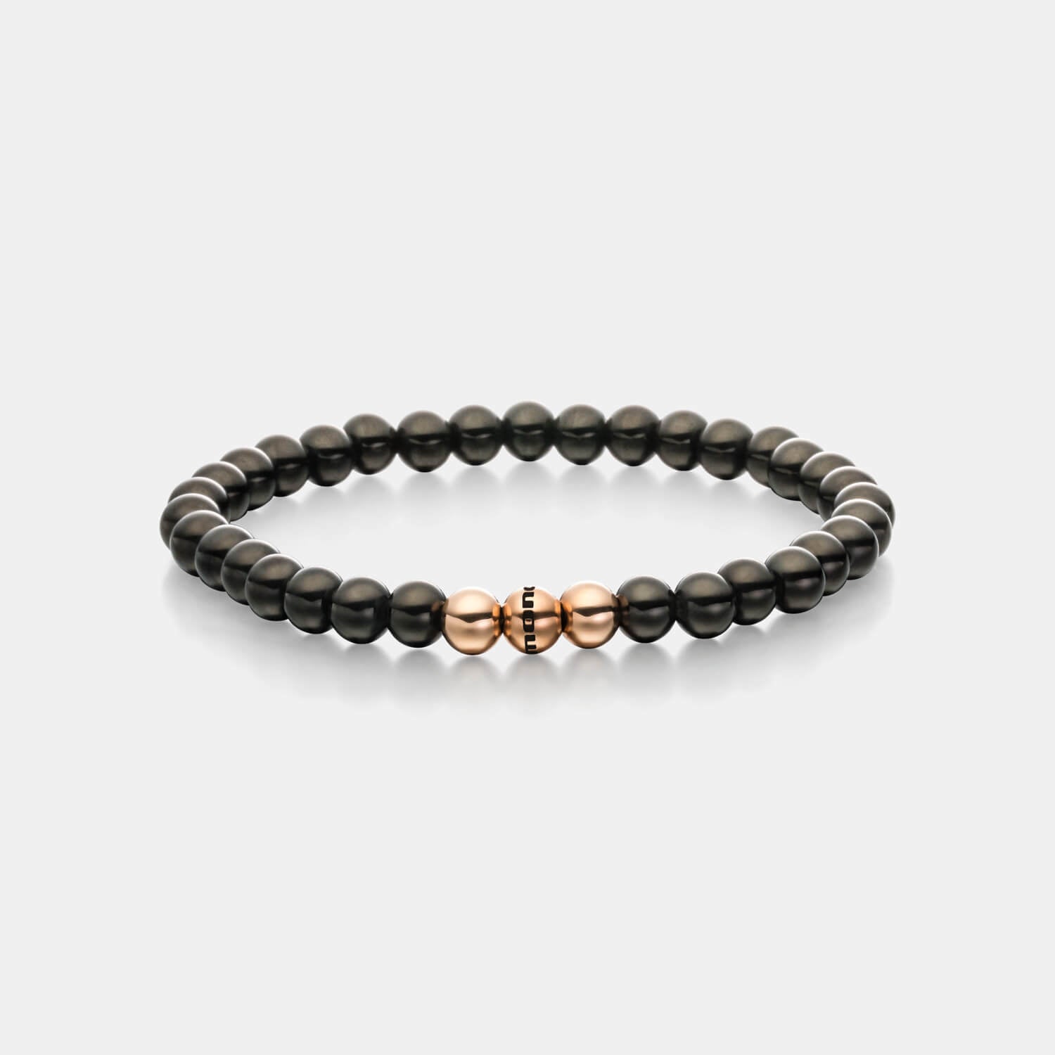Gesamtansicht eines Perlenarmbandes aus schwarzen und roségoldfarbenen Edelstahl-Perlen.