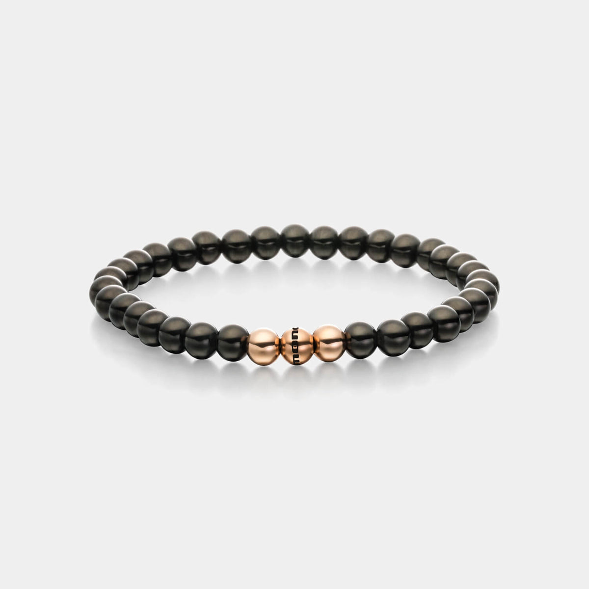 Gesamtansicht eines Perlenarmbandes aus schwarzen und roségoldfarbenen Edelstahl-Perlen.