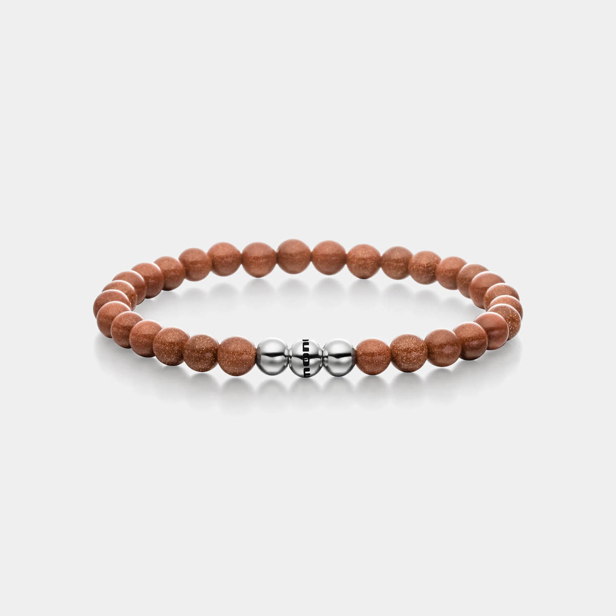 Gesamtansicht eines braunen Perlenarmbandes aus echten Goldflussperlen mit drei antiallergenen Edelstahlperlen.
