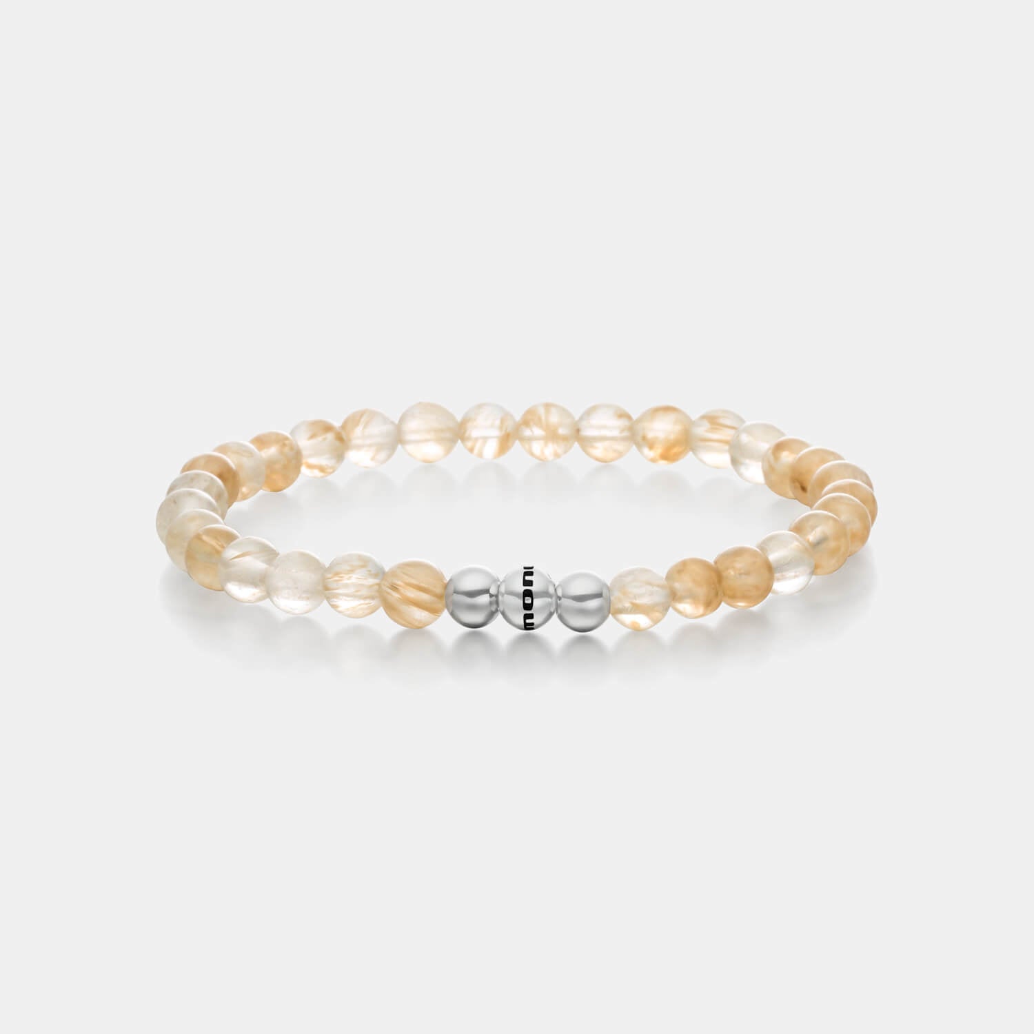 Gesamtansicht eines gelben Perlenarmbandes aus Rutilquarz mit drei polierten, antiallergenen Edelstahlperlen von MONOMANIA.