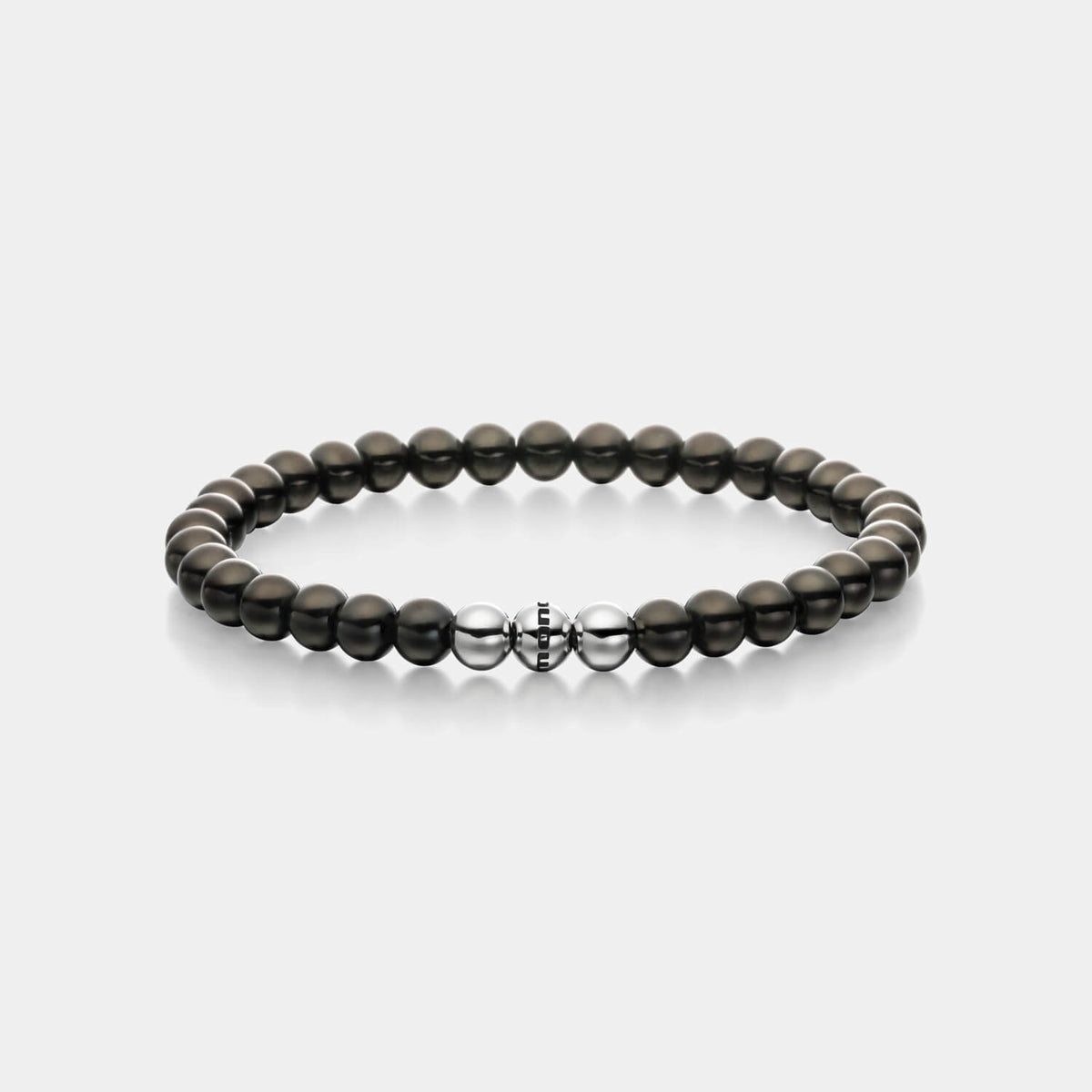 Gesamtansicht eines schwarzen Perlenarmbandes aus schwarz-beschichteten, antiallergenen Edelstahl-Perlen mit drei silberfarbenen Edelstahlperlen.
