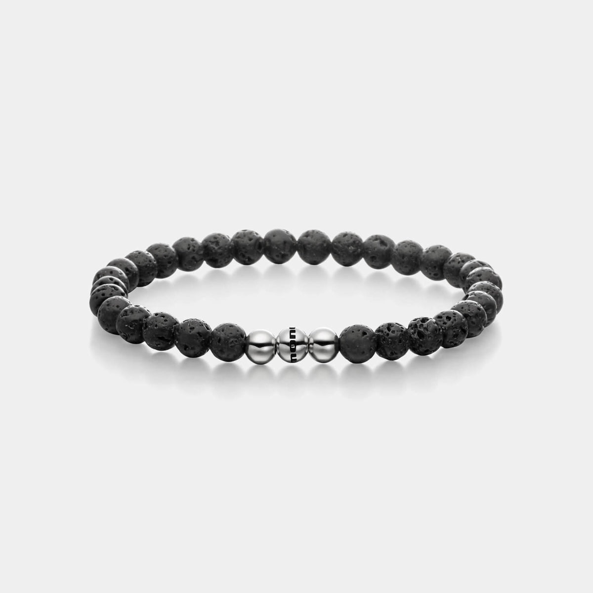Gesamtansicht eines schwarzen Perlenarmbandes aus echten Lavaperlen mit drei antiallergenen Edelstahlperlen.