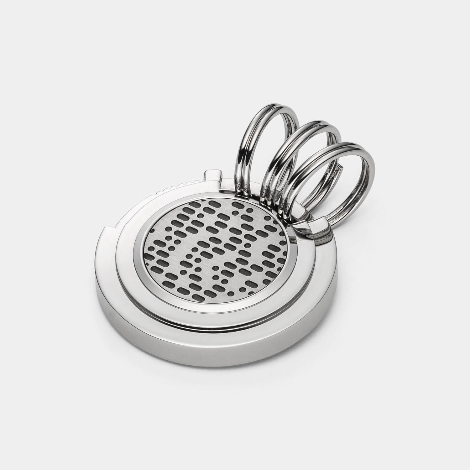 Gesamtansicht eines runden Edelstahl-Schlüsselanhängers mit schwarzen Morsezeichen von MONOMANIA.