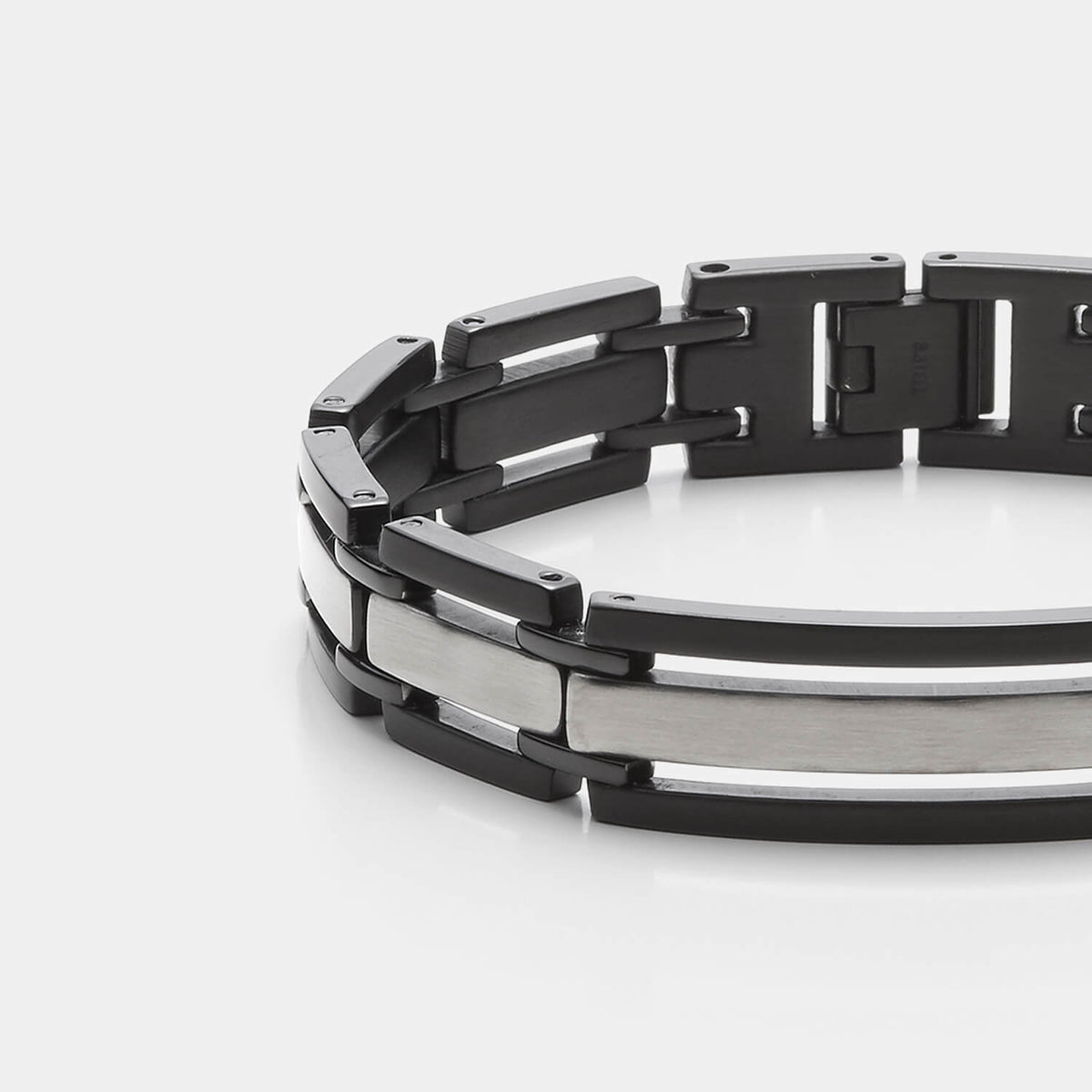 Gesamtansicht eines markanten, schwarz-silbernen Gliederarmbandes aus antiallergenem Edelstahl von MONOMANIA.