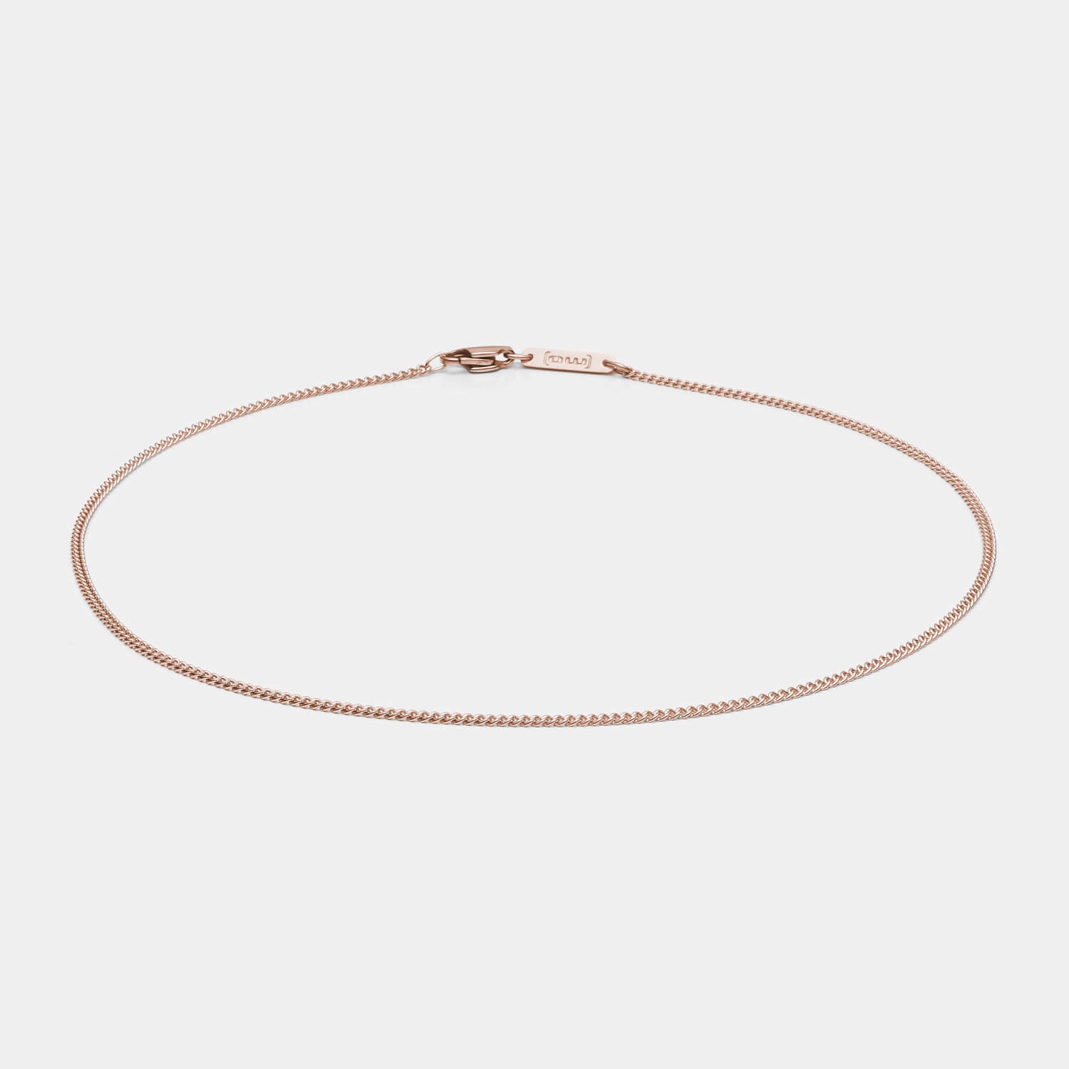 Zeitlose, diamantierte Panzerkette aus antiallergenem Edelstahl mit roségoldfarbener PVD-Beschichtung und Karabinerverschluss von MONOMANIA in Gesamtansicht.